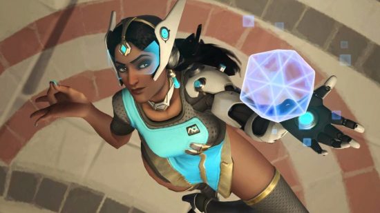 Overwatch Symmetra trick will make you happy servers are closing: Indian woman wearing futuristic dress and visor looks up at camera while creating a geometric sphere of light