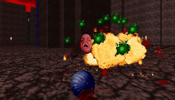 Rise of the Triad: Ludicrous Edition: the red-faced El Oscuro is defeated in a pixelated mass of explosions and green energy orbs, with a magic staff held in the foreground by the player