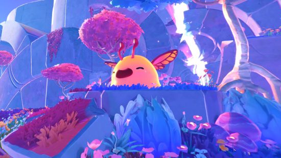 Slime Rancher 2 sales figures prove the life sim needed a sequel: A golden slime with butterfly wings smiles a toothless smile in a blue and purple forest