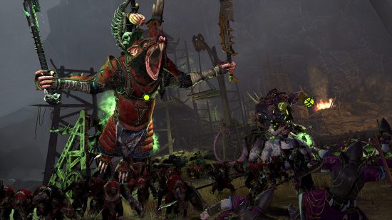 Total War: Warhammer 3 update 2.2: A Skaven lord wearing red armour and grisly war trophies roars as it leaps forward to strike in the heat of a ferocious battle