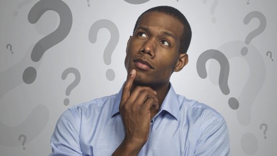 "What is a VPN?" a man ponders, surrounded by question marks.