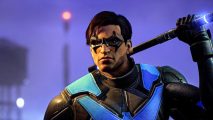 Gotham Knights PC port should no longer be unplayable online: a close up of Nightwing, pulling his baton from behind his head