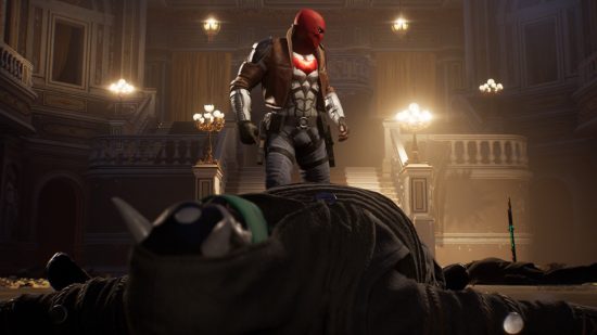 Gotham Knights - Red Hood stands over an knocked-out enemy