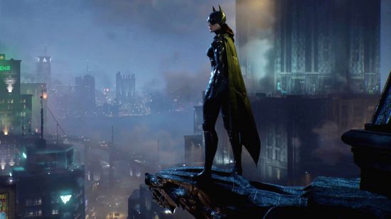 Gotham Knights review - Batgirl stands on a grotesque, looking over Gotham City