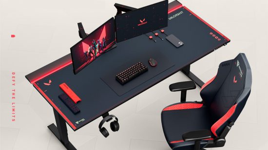 The Secretlab Valorant collection, including a gaming chair with its gun buddy and gaming desk with two monitors, a keyboard, and a mouse on top