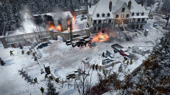 Best Strategy games - a manor house covered in snow is being shot at by troops surrounding it in Company of Heroes 2: Ardennes Assault. A barn is on fire.