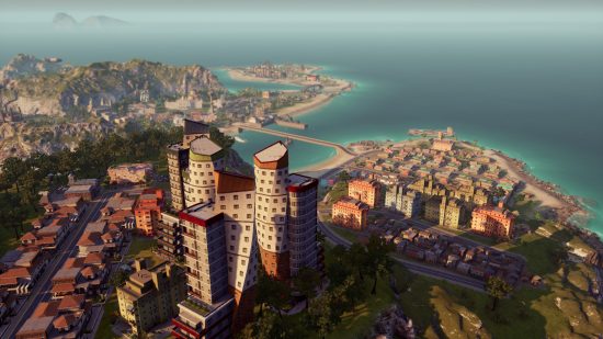 Bästa tycoon -spel: En översikt över ett bostadsområde, med en liten förort dvärgad av ett stort flerfamiljshus i Tropico 6