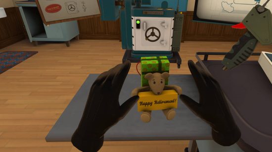 Best VR games - the agent has just found a toy bear holding a banner with "Happy Retirement!" written on it. There is a present behind them that's suspiciously hooked up to a wire.