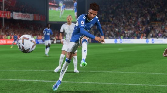 How to do a FIFA 23 power shot: a football player dressed in blue takes a powerful shot on goal