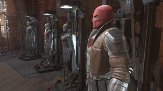 Gotham Knights change characters: Red Hood, Batgirl, Robin, and Nightwing suits all on display in the Belfry.