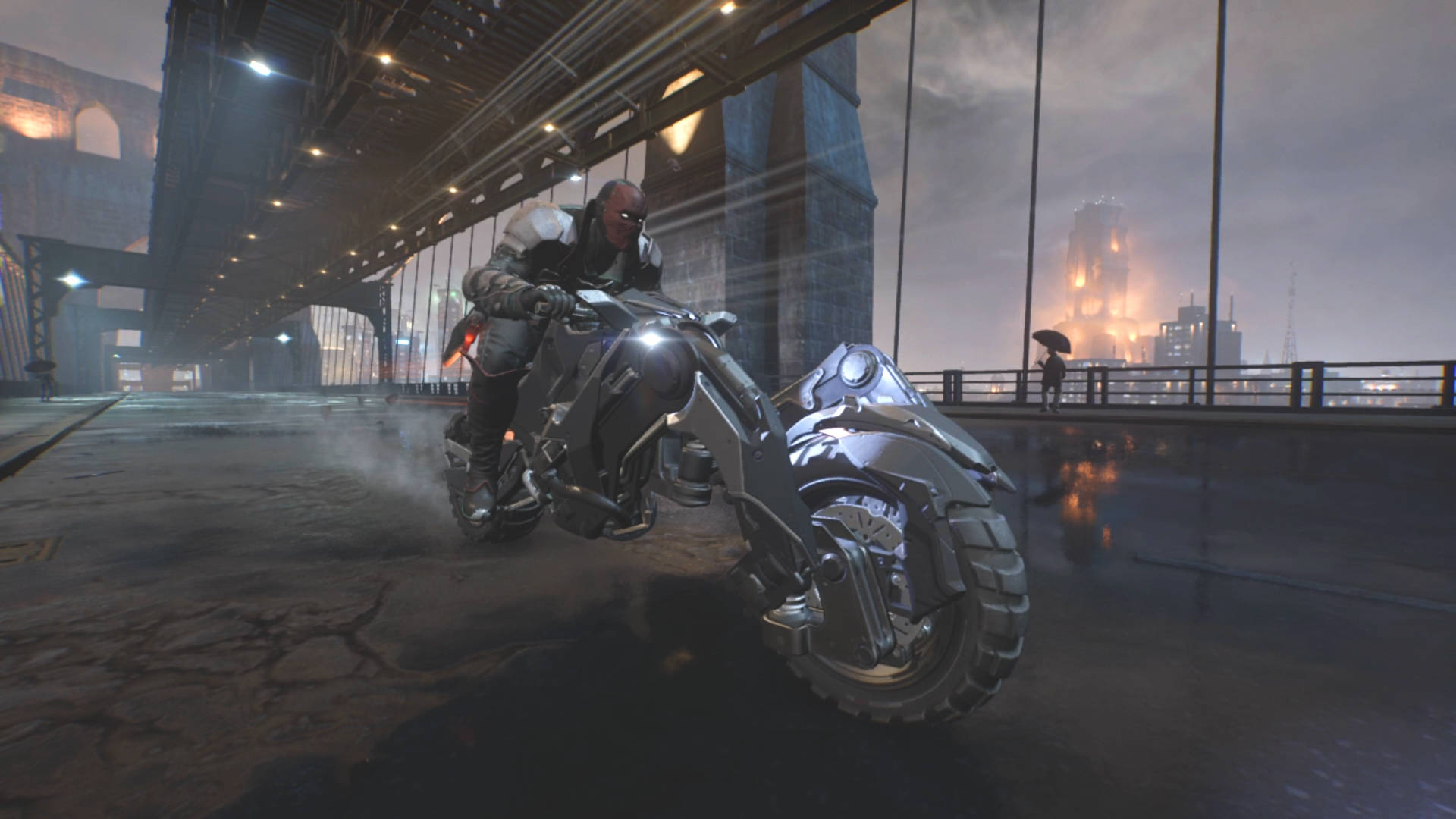 Gotham Knights styles: Red Hood is riding the Batcycle across a suspension bridge. The Kane tower can be seen in the background.