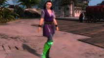New Guild Wars 2 character brings real-life hero to the MMO: A girl with black hair in bnches stands wearing a purple pinafore with arms by her side and her prosthetic green leg on show