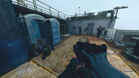 How to kill the enemy in the porta-potty: a solider looks on at a dead body, slumped on a toilet