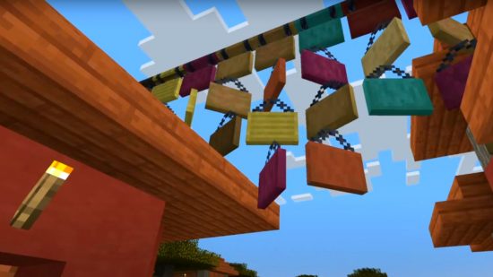 Висящи табели Minecraft използваха ограждане над село