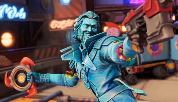 Moonbreaker update monetisation: A close-up shot of a Moonbreaker miniature depicting a bearded hero painted all blue, holding a pistol and smiling roguishly