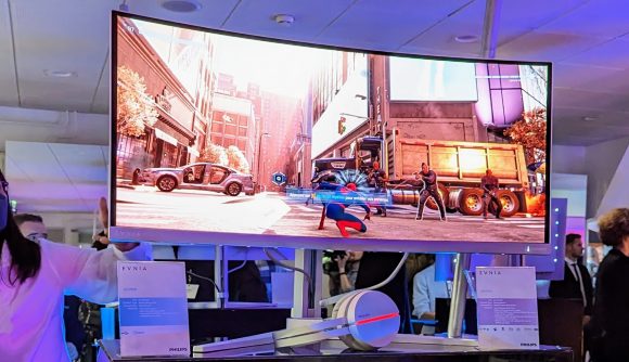 The Philips Evnia 34M2C8600 gaming monitor, featuring Philips Ambiglight, with Marvel's Spider-Man Remastered on its screen