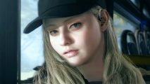 Resident Evil Village - Rose Winters, a young woman with long blonde hair and a plain black baseball cap, sits on a bus seat