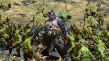 Total War: Warhammer 3 hotfix 2.2.1: An ogre warrior stands amid a crowd of green Nurgle daemons