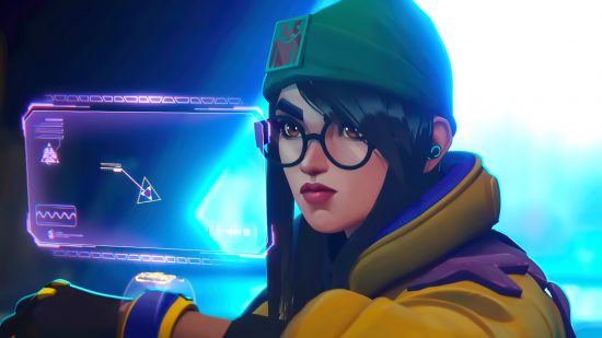 Valorant smurfs will need to watch out in FPS' new Premier mode: A woman wearing a green beanie hat and yellow puffer jacket with nerd-style glasses looks at a purple hologram with a concerned expression