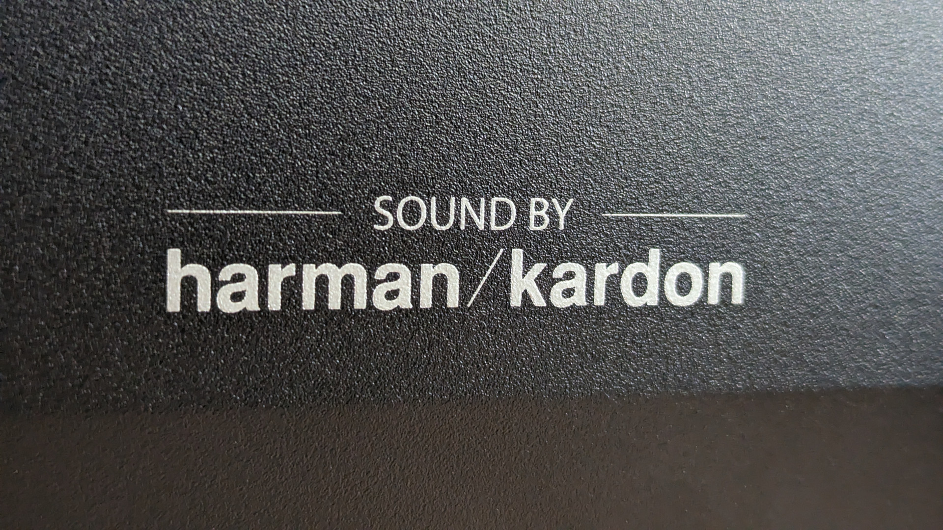 A close up of the rear of the Asus ROG Swift PG48UQ, in which the logo for harman/kardon can be seen