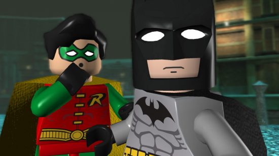 Best Batman games - Batman stands on a dock with Robin, who has his hand to his face in a worried expression in Lego Batman.