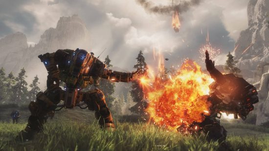 Best robot games - a mech has one hand on its hip as it blasts a robot with the other hand in Titanfall 2. A third robot is dropping from high up.