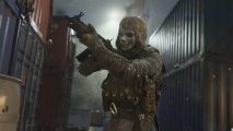 Call of Duty: Warzone Caldera to launch alongside Warzone 2: A masked soldier raises a rifle while standing between stacked shipping containers