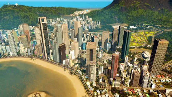 Cities: Skylines expansion series: Skyscrapers cluster around a beach with jungle-covered hills in the background