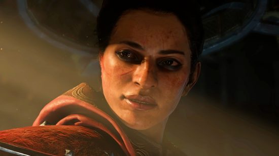 Diablo 4 open-world - a female rogue looks down over her shoulder with a stern expression