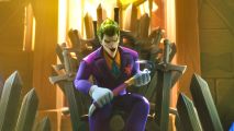 Multiversus upcoming characters: The Joker is sat on the Iron Throne, about to summon baddies with the help of the rift. He's holding a crowbar.