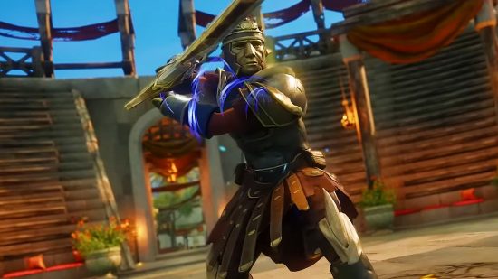New World leaderboards coming soon to MMO, but seem "underwhelming": A gladiator with a helmet shaped like a face holds a huge great sword fighting in an arena