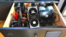 Blurred image of gaming PC in drawer with RTX 2070 graphics card layered on top