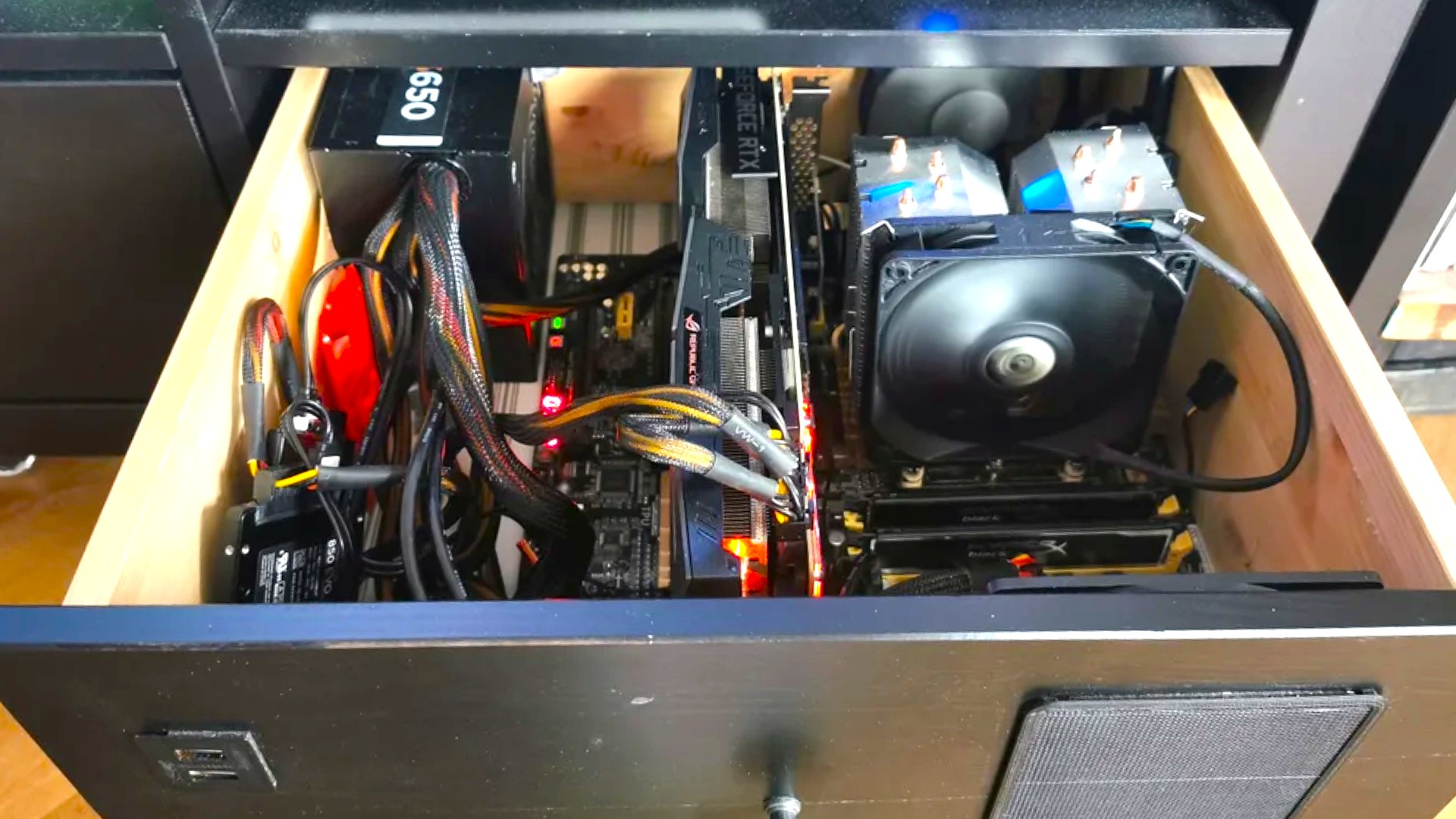Image of gaming PC installed in a desk drawer