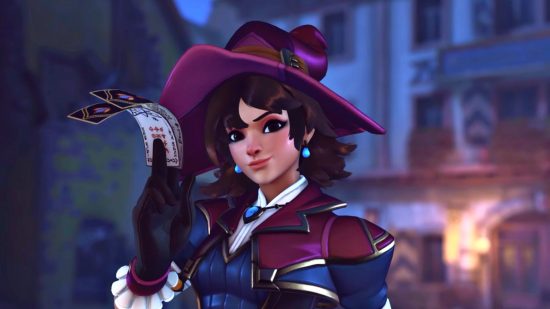 Overwatch 2 character skins now sold separately, players still miffed: close up of Overwatch 2 character Kiriko in a Witch-themed skin, smirking and holding some paper