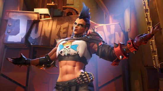Overwatch 2 tier list: Junker Queen standing with her arms wide, inviting the gladiatorial combatants to attack her in Junker Town.