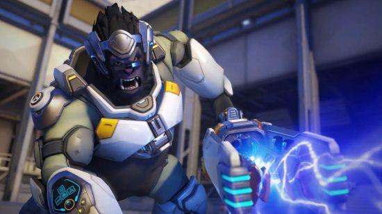 Overwatch 2 tier list: Winston advancing towards an enemy as electricity crackles from his cannon.