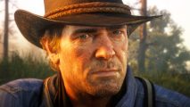 Red Dead Redemption 2 mod adds new hitman missions to Rockstar sandbox: A rugged cowboy, Arthur Morgan from Red Dead Redemption 2, sits in the sandbox game sun