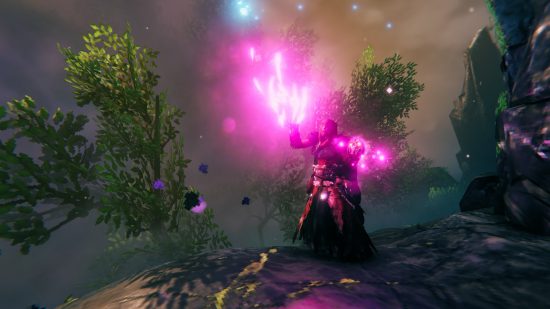 Valheim Mistlands update - a character in a misty forest wielding purple sparks of magic as they hold a glowing skull in one hand