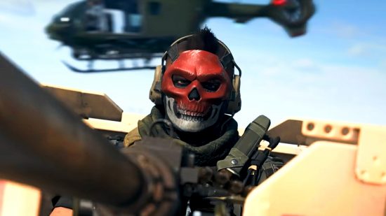 Warzone 2 - a figure in a red and grey skull mask sits behind a cannon, a helicopter flying past in the background