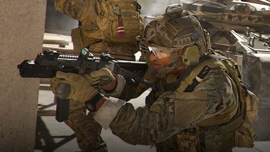 Warzone 2 Release Time: The operator looks down at the sights of his weapon