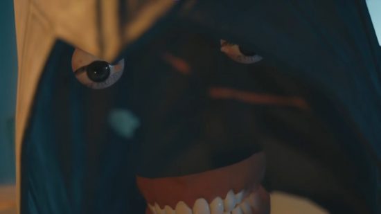 Assassin's Creed Unity face bug sees the skin missing and only the teeth and eyes floating beneath a raised hood