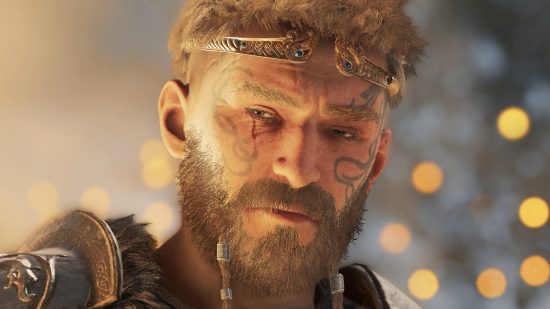 Assassin’s Creed Valhalla becomes a free Steam game, Ubisoft confirms. A Viking warrior with face tatoos stares devilishly in the sandbox game AC Valhalla