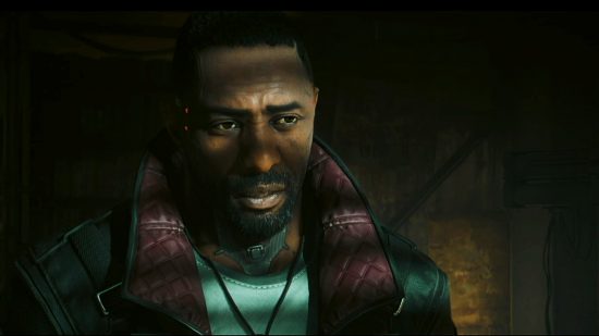 Cyberpunk 2077 DLC to star Idris Elba: Idris Elba appears as Solomon Reed in Phantom Liberty, in a dark room lit by dim sun through blinds