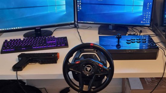Gaming PC arcade - a desk holding a Sinden Light Gun, a Thrustmaster T128 wheel, and a Razer Panthera fight stick, as well as a keyboard and mouse.