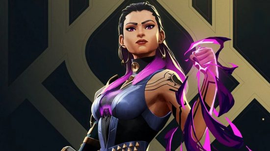 Valorant smurfs have decreased, but Riot isn't done yet: A tanned woman with slicked back black hair and geometric tattoos stands holding purple energy on a black and gold background