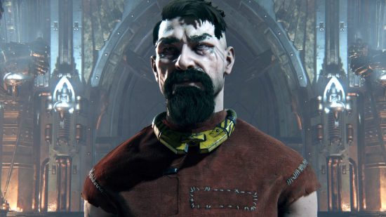 Warhammer 40k Darktide hotfix: A 'reject' stands in red prison dungarees and a metal yellow collar, he is older and scarred, with a brown beard and hastily cut hair