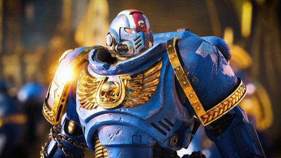 Warhammer 40K Space Marine 2 gameplay unveils Steam shooter at TGAs. A space marine in huge blue armour, Titus from Warhammer 40K, stands at attention