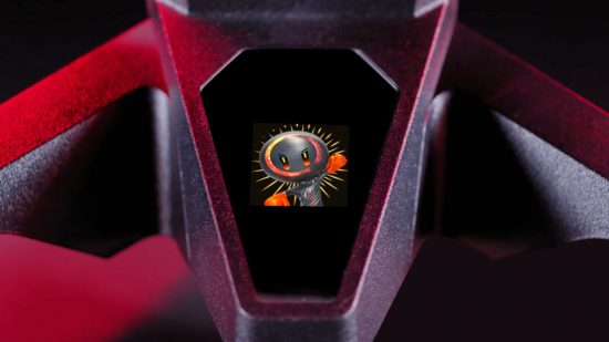 The Asrock PG34WQ15R3A gaming monitor's OLED screen built into the stand shows a mascot fist pumping the air