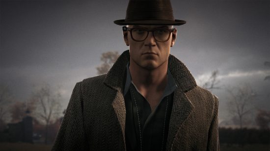 Hitman trilogy rebranding to make purchasing the stealth game easier: agent 47 in a tweed jacket and hat with a brim and glasses, with the gloomy grey sky behind him