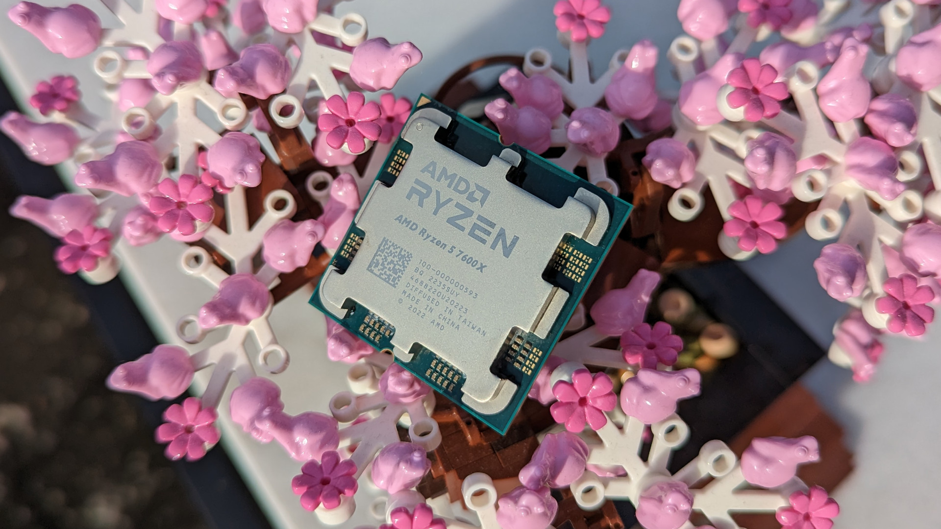 The AMD Ryzen 5 7600X processor, atop a Lego bonsai tree